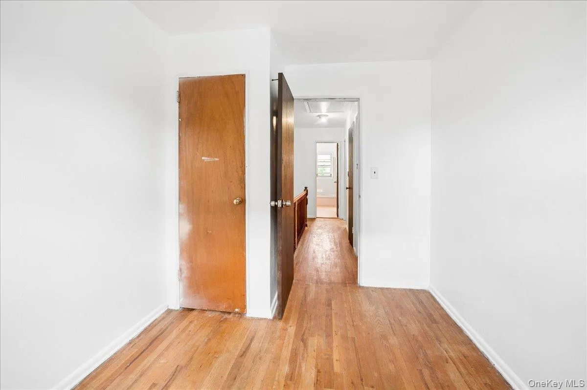 Interior hallway with wood-finish flooring Interior hallway with wood-finish flooring