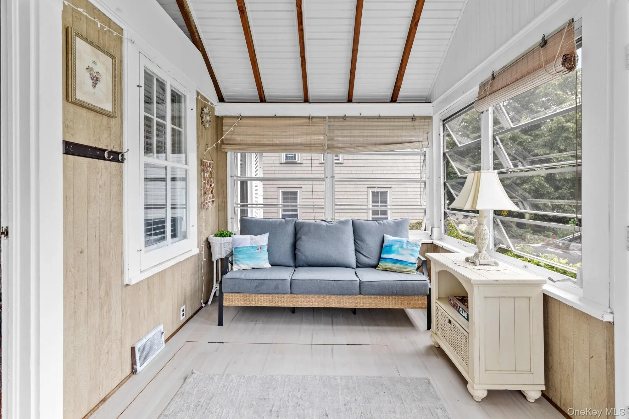 Sunroom / solarium featuring healthy amount of natural light and an outdoor living space Sunroom / solarium featuring healthy amount of natural light and an outdoor living space