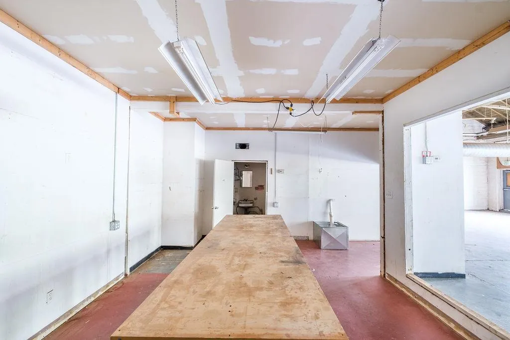 Hall featuring finished concrete flooring Hall featuring finished concrete flooring