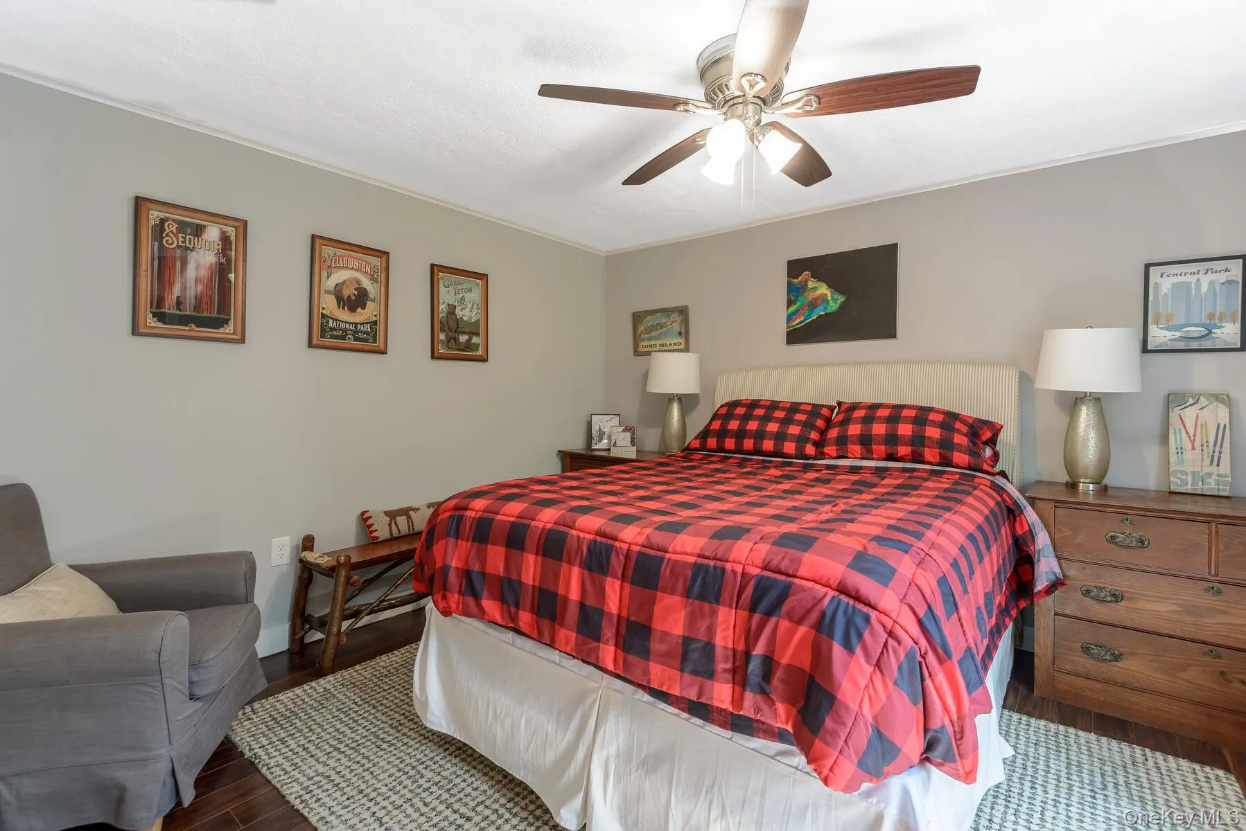 Bedroom featuring baseboards, a ceiling fan, and wood finished floors Bedroom featuring baseboards, a ceiling fan, and wood finished floors
