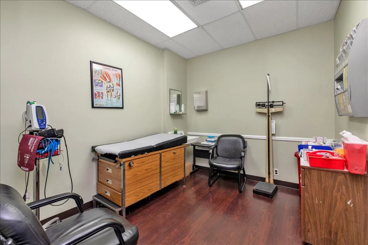 Office featuring a paneled ceiling and dark wood-style floors Office featuring a paneled ceiling and dark wood-style floors