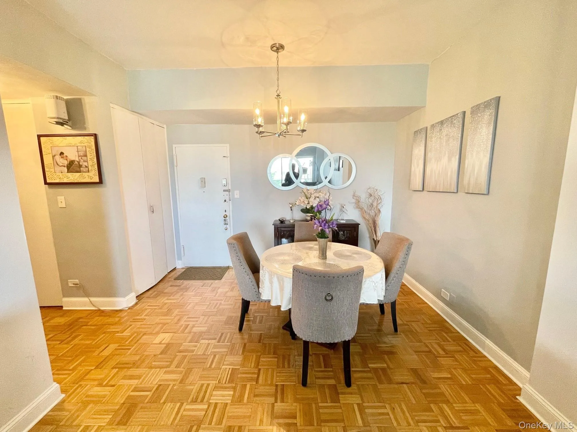 Dining space with baseboards and an inviting chandelier Dining space with baseboards and an inviting chandelier