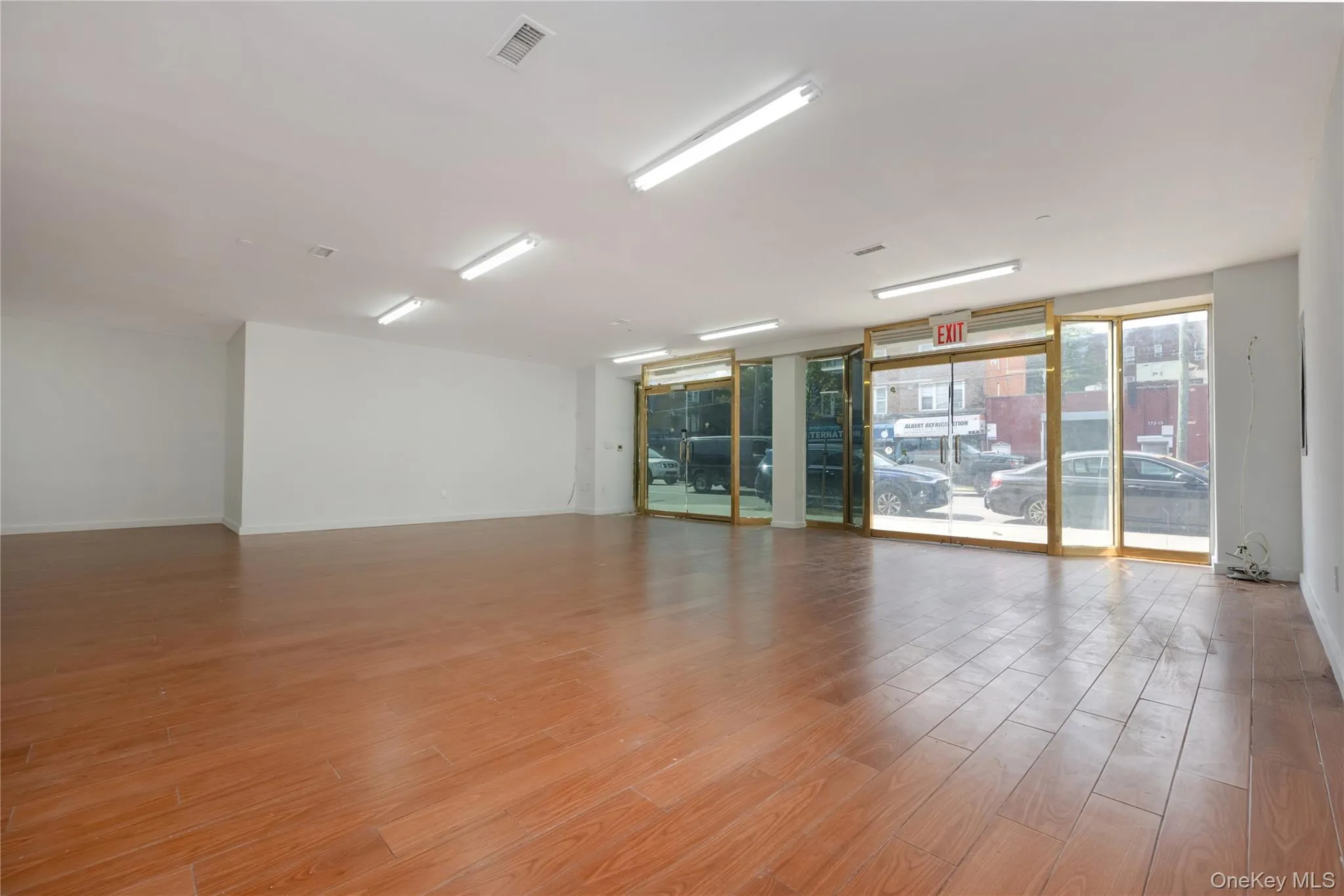 Unfurnished room with light wood-type flooring and baseboards Unfurnished room with light wood-type flooring and baseboards