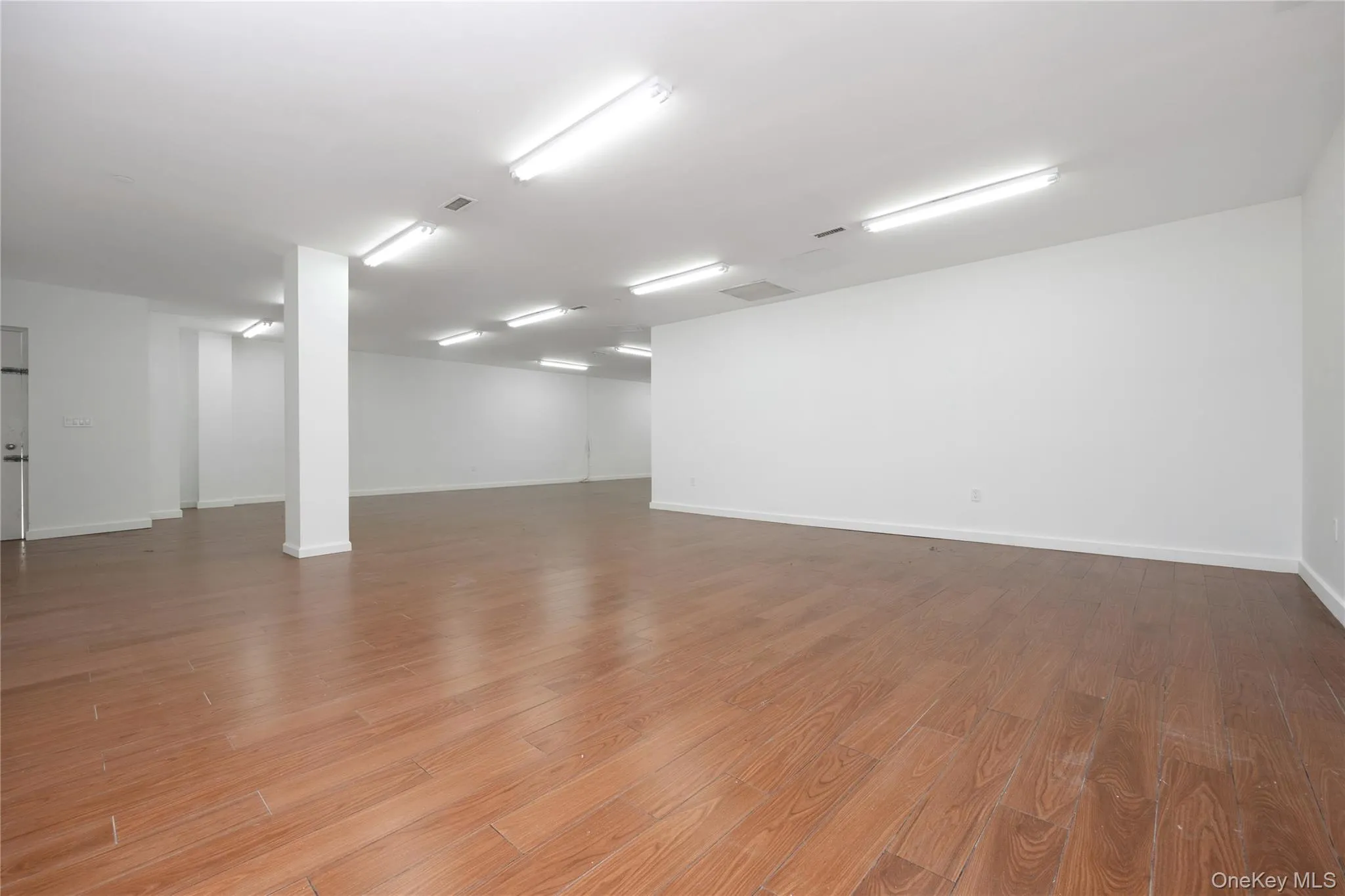 Empty room with light wood finished floors Empty room with light wood finished floors