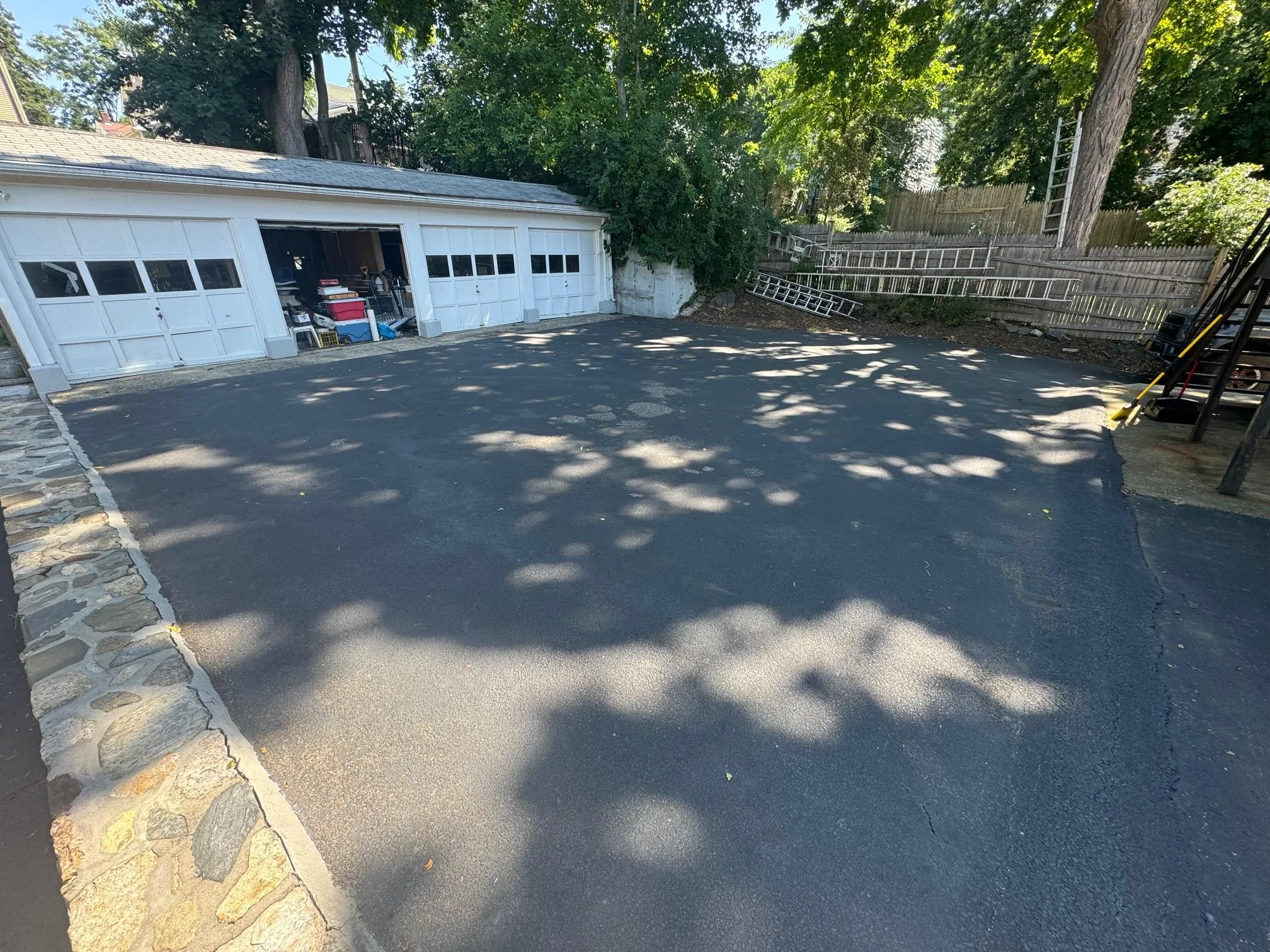 Detached garage featuring fence Detached garage featuring fence