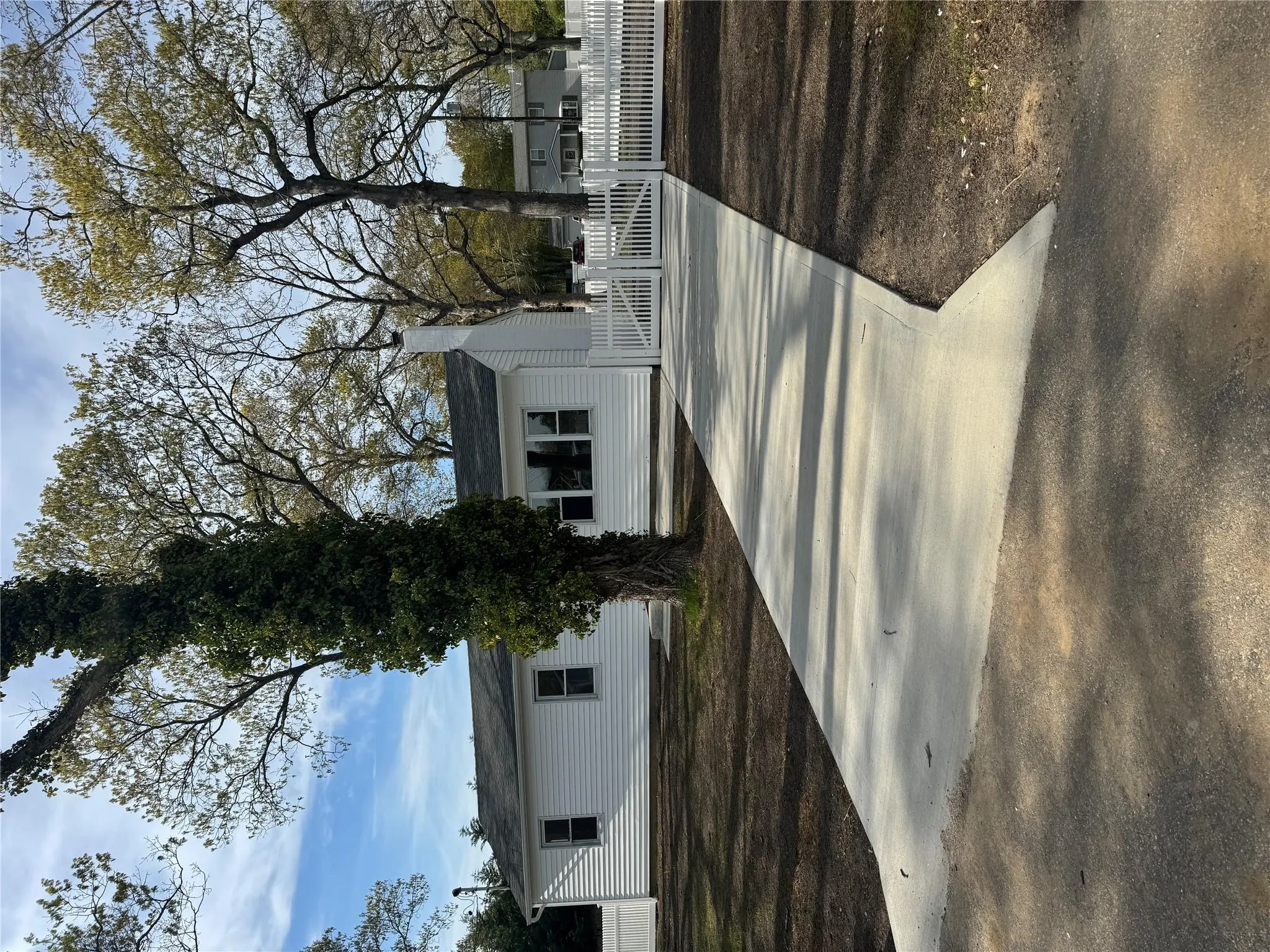 View of front facade featuring fence and a chimney View of front facade featuring fence and a chimney