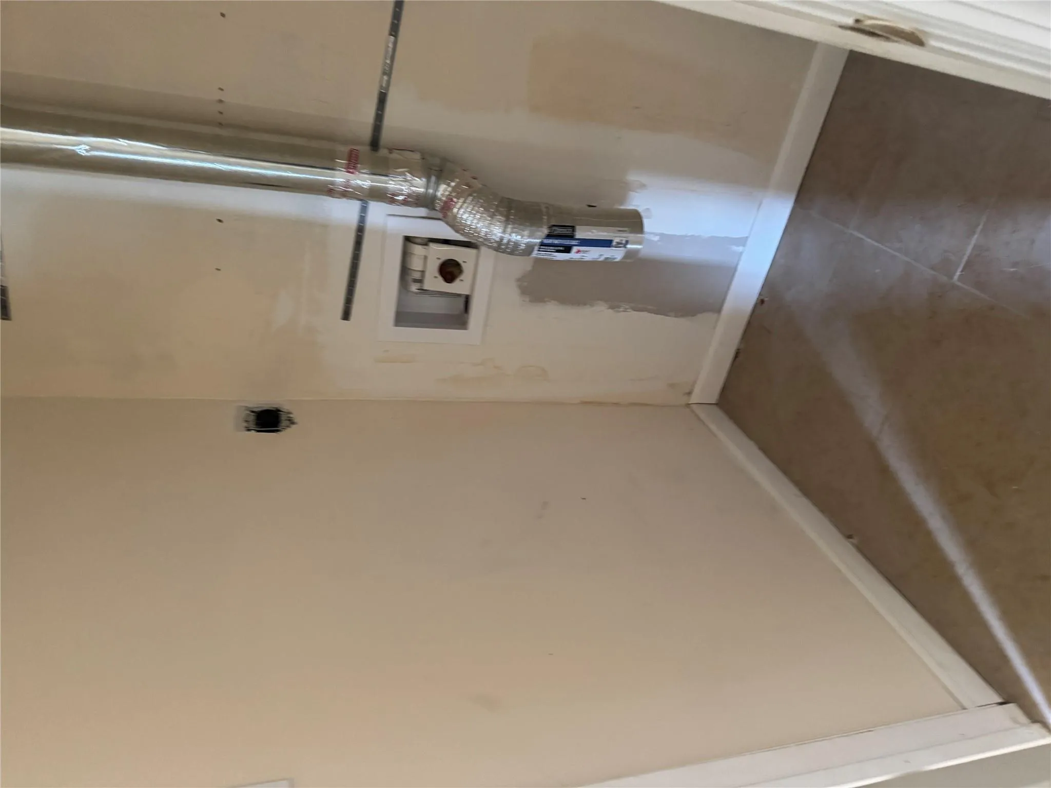 Laundry area with laundry area, electric dryer hookup, baseboards, and hookup for a washing machine Laundry area with laundry area, electric dryer hookup, baseboards, and hookup for a washing machine