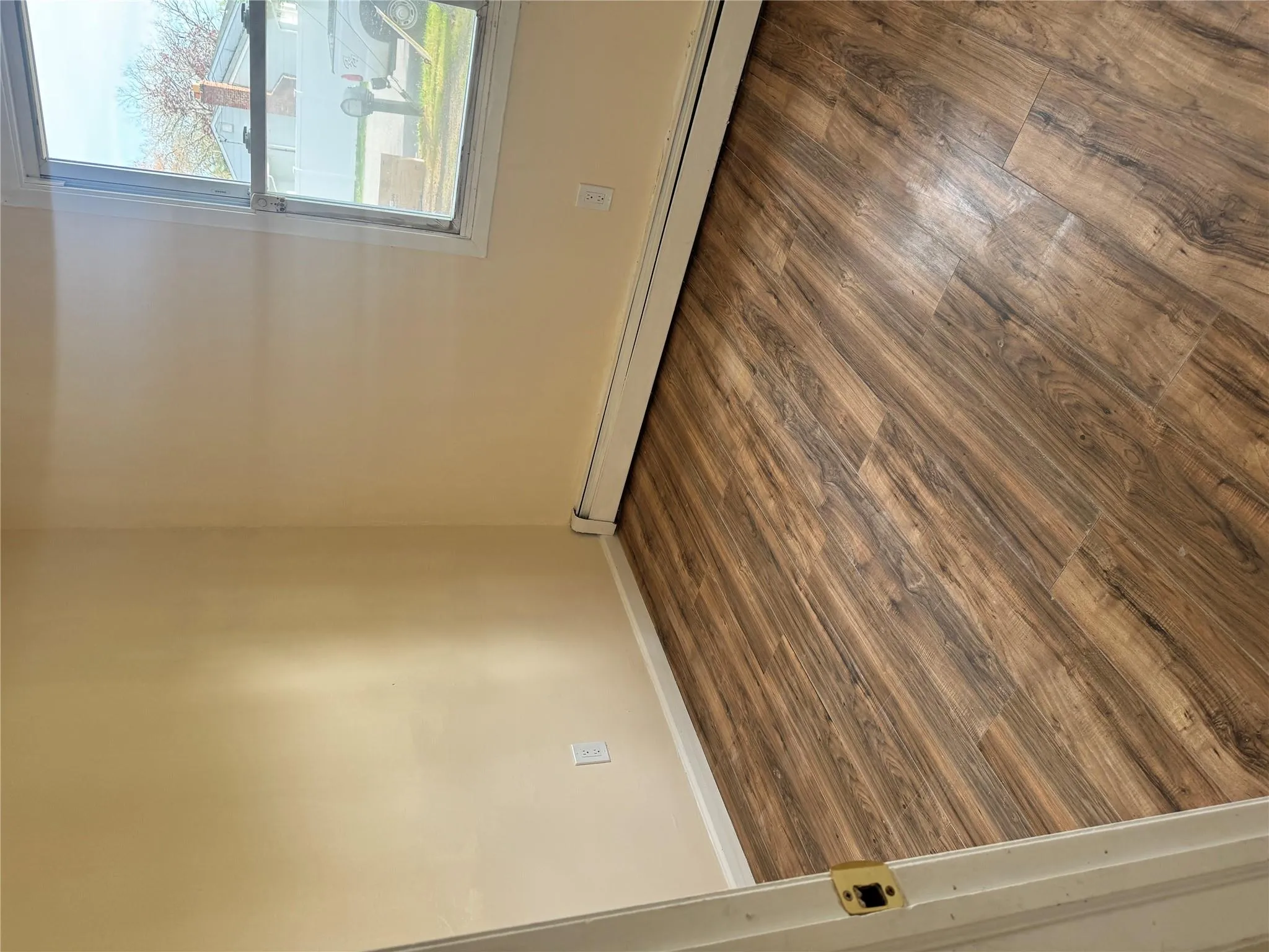 Spare room featuring baseboards, a baseboard heating unit, and wood finished floors Spare room featuring baseboards, a baseboard heating unit, and wood finished floors
