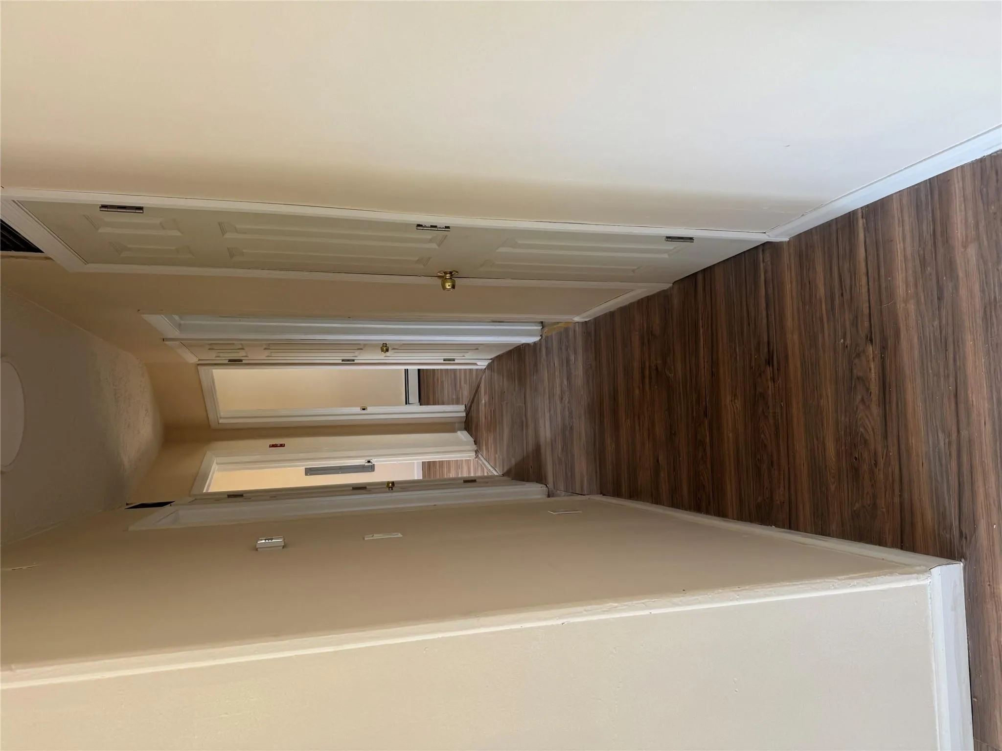 Corridor with baseboards and dark wood-style flooring Corridor with baseboards and dark wood-style flooring