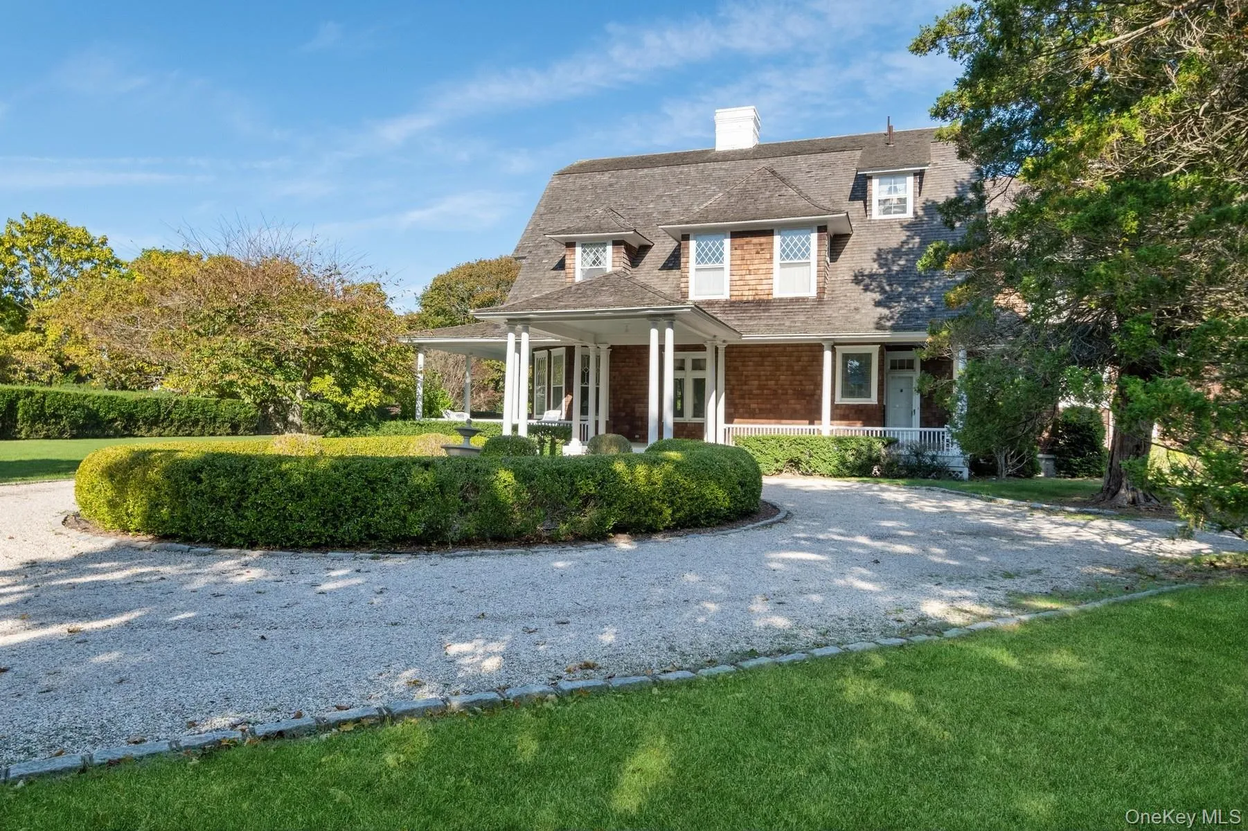 Shingle-style home with covered porches, spacious front and back yards Shingle-style home with covered porches, spacious front and back yards