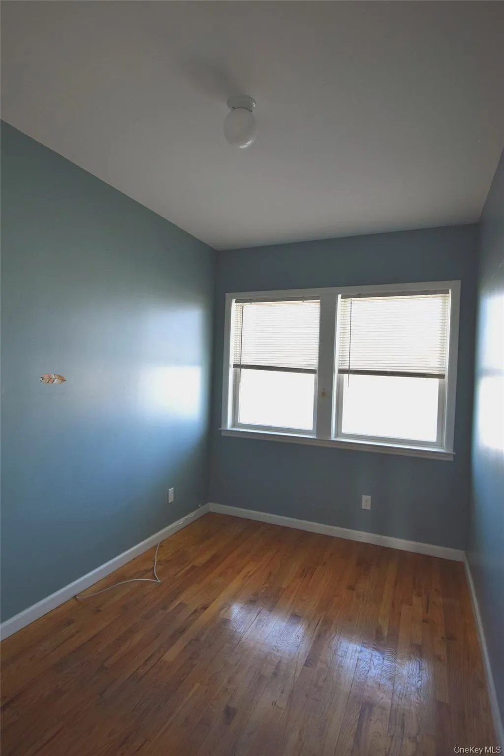 Bedroom #1 on 1st floor with baseboard heat and wood finished floors Bedroom #1 on 1st floor with baseboard heat and wood finished floors