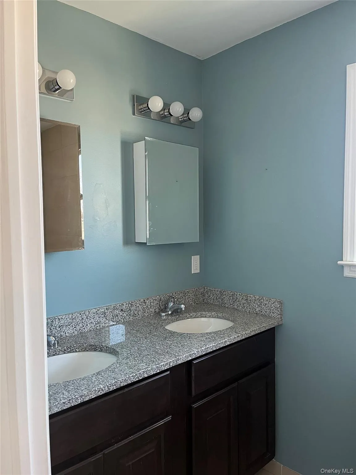 Bathroom with double vanity and a sink Bathroom with double vanity and a sink