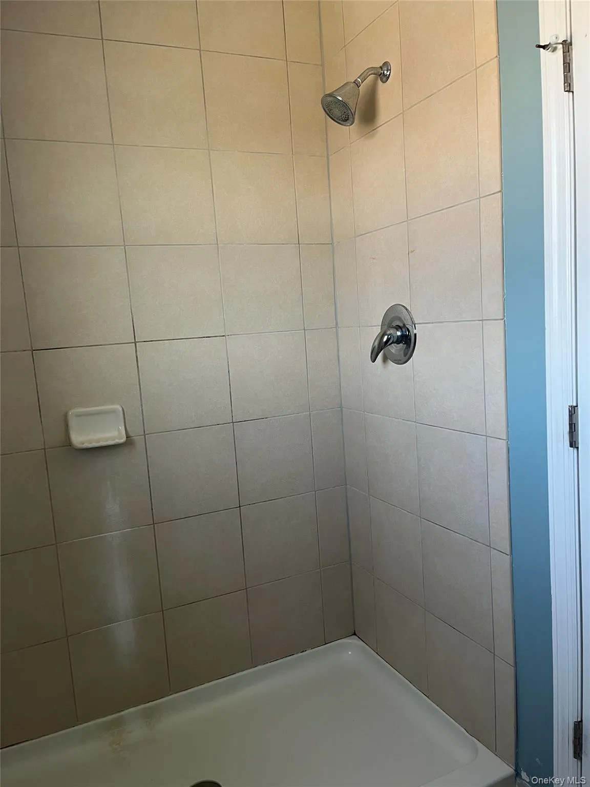 Bathroom with a tile shower Bathroom with a tile shower