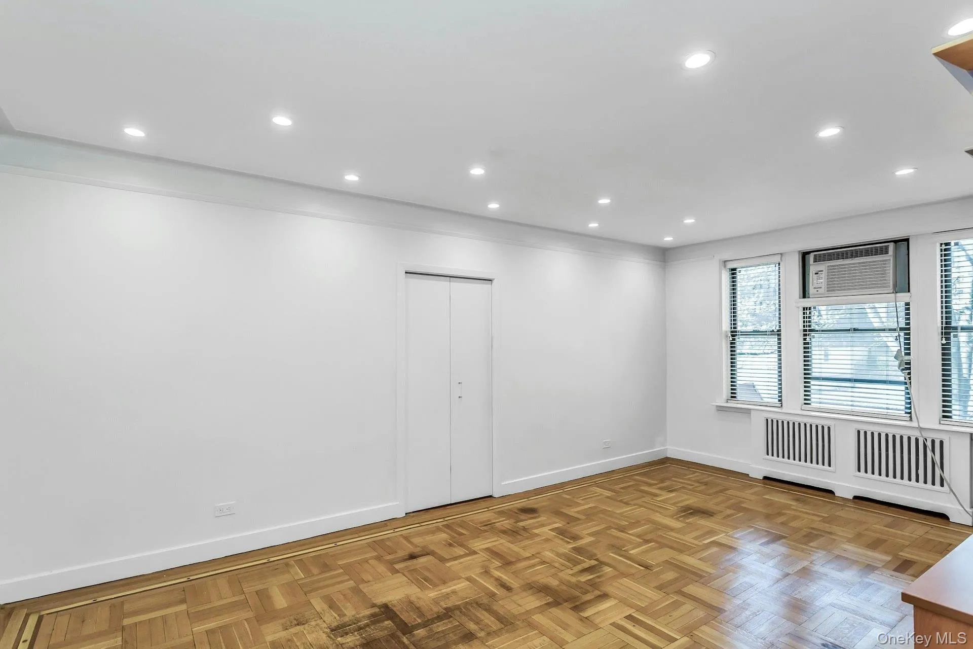 Empty room with baseboards and recessed lighting Empty room with baseboards and recessed lighting