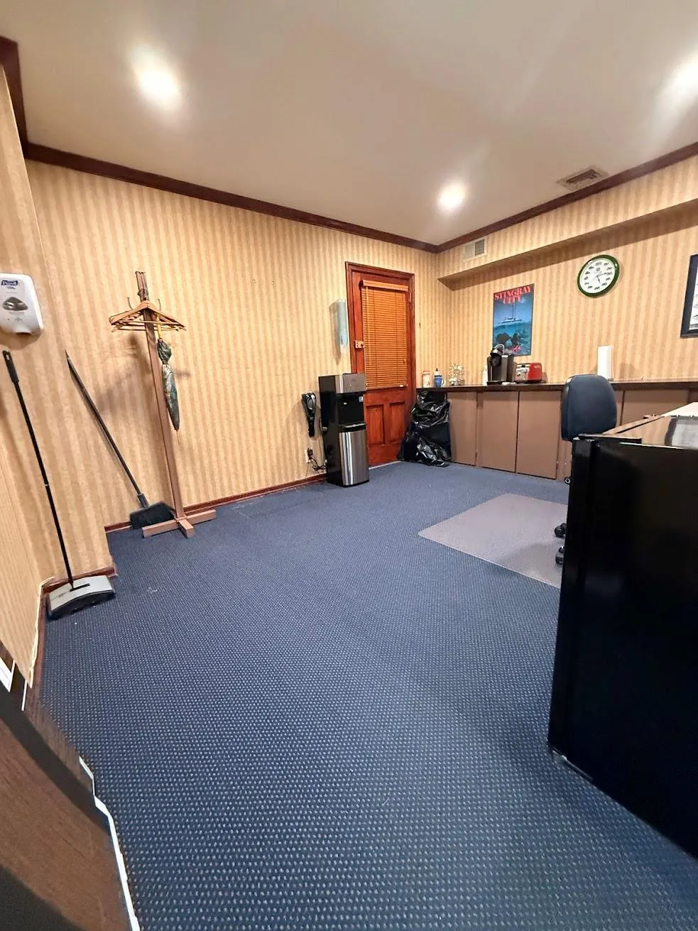 Office area with wallpapered walls, visible vents, carpet, and ornamental molding Office area with wallpapered walls, visible vents, carpet, and ornamental molding