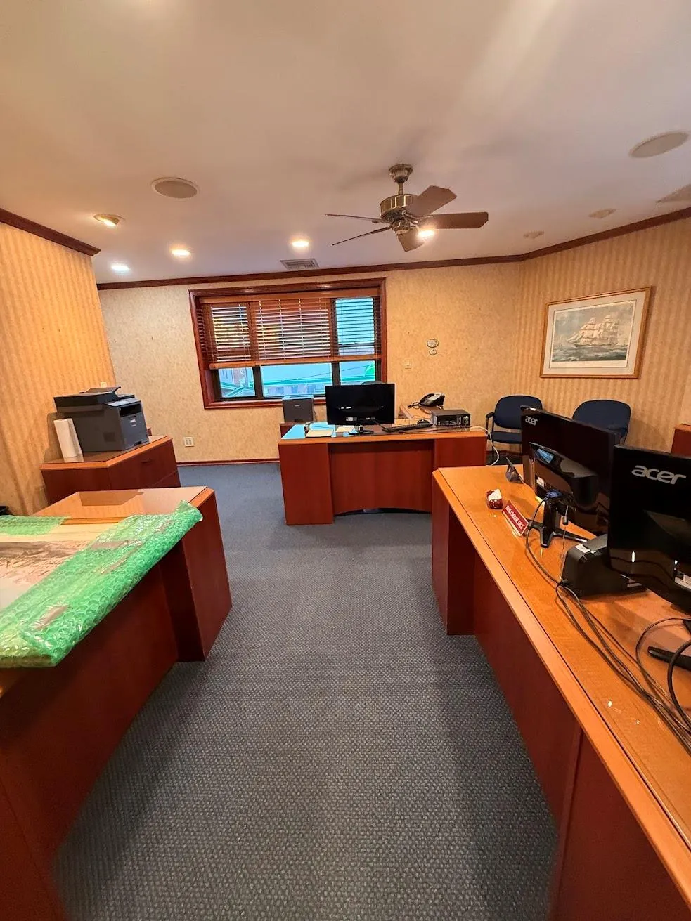 Office area with dark carpet, crown molding, and ceiling fan Office area with dark carpet, crown molding, and ceiling fan