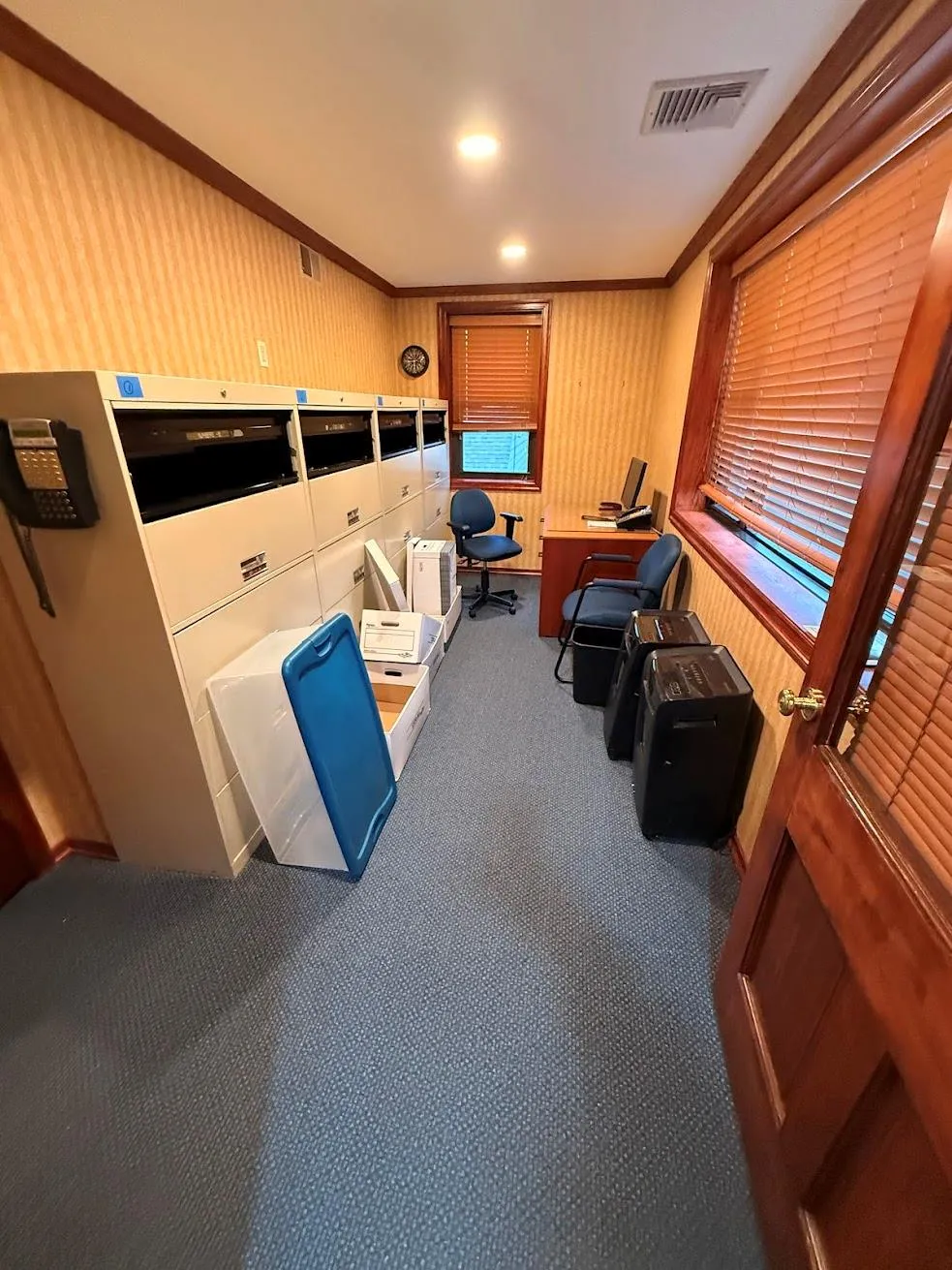 Miscellaneous room featuring carpet, visible vents, and ornamental molding Miscellaneous room featuring carpet, visible vents, and ornamental molding