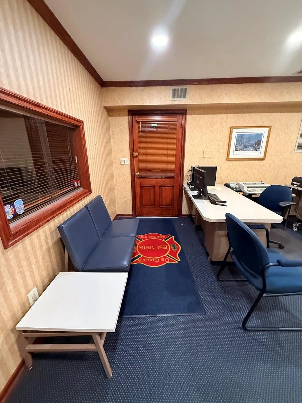 Carpeted home office featuring wallpapered walls, visible vents, and crown molding Carpeted home office featuring wallpapered walls, visible vents, and crown molding