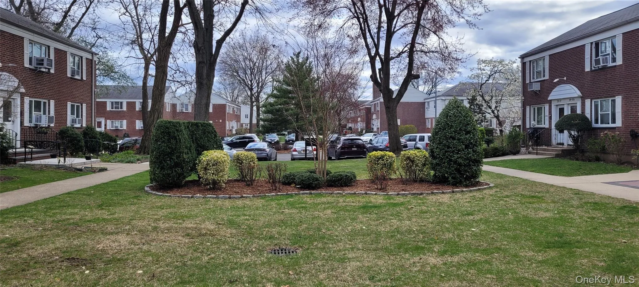 View of property's community featuring a yard and a residential view View of property's community featuring a yard and a residential view