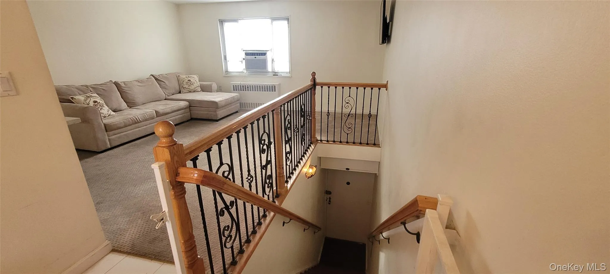 Stairway with baseboards and radiator heating unit Stairway with baseboards and radiator heating unit