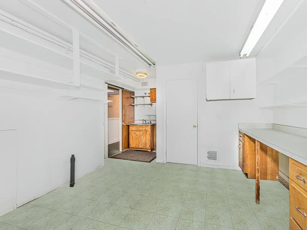 Basement with visible vents and light floors Basement with visible vents and light floors