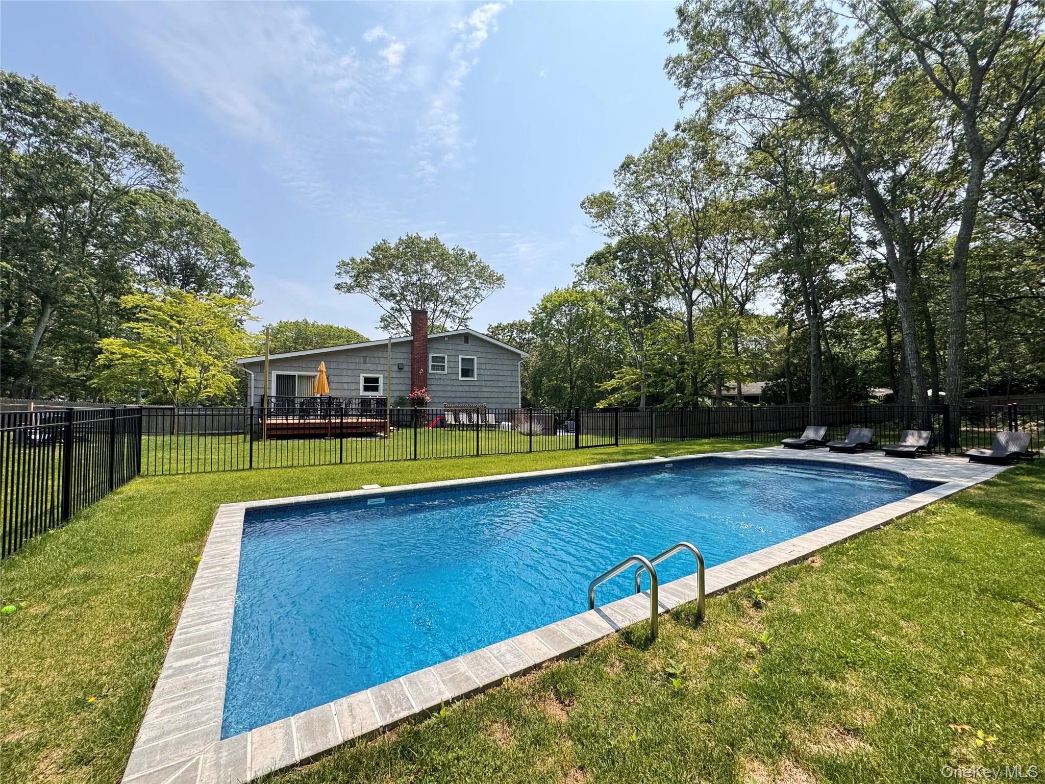 View of pool with a fenced backyard View of pool with a fenced backyard