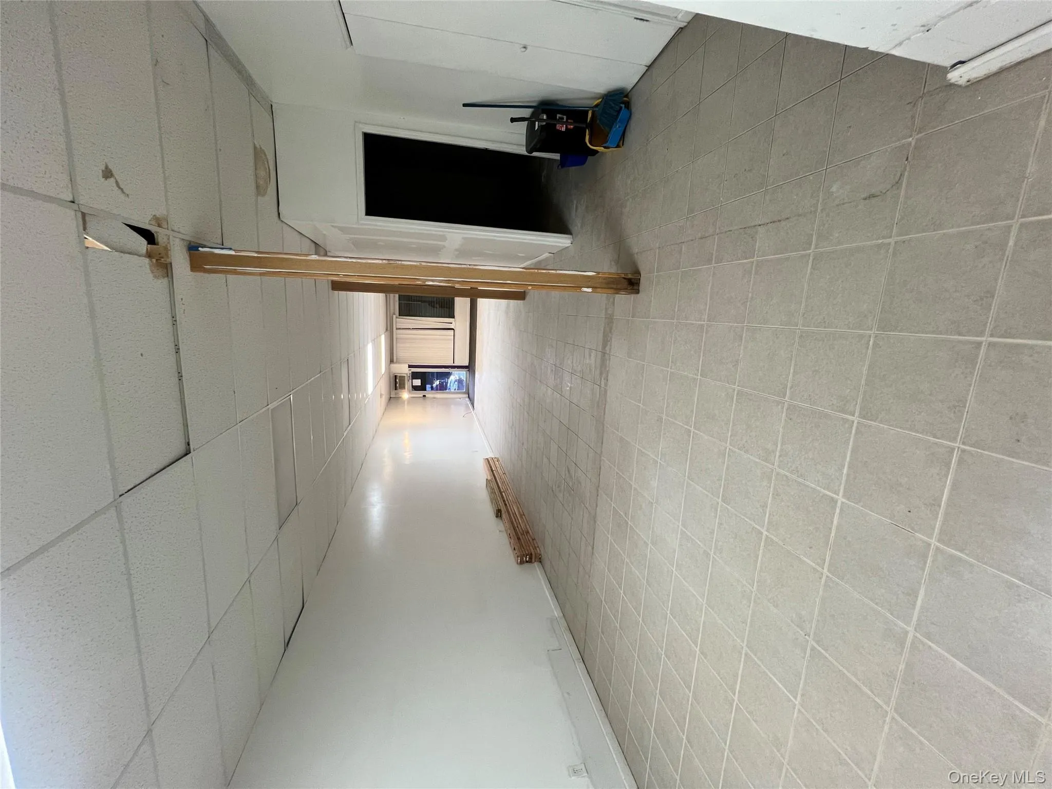 Finished basement featuring a paneled ceiling Finished basement featuring a paneled ceiling