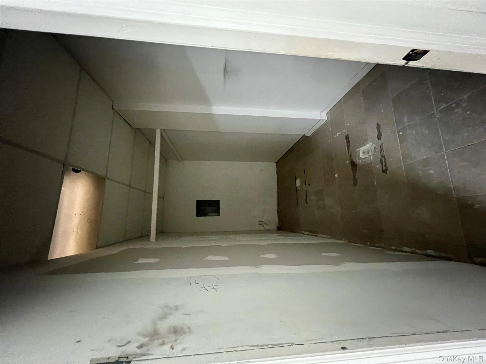 Hall with electric panel and a paneled ceiling Hall with electric panel and a paneled ceiling