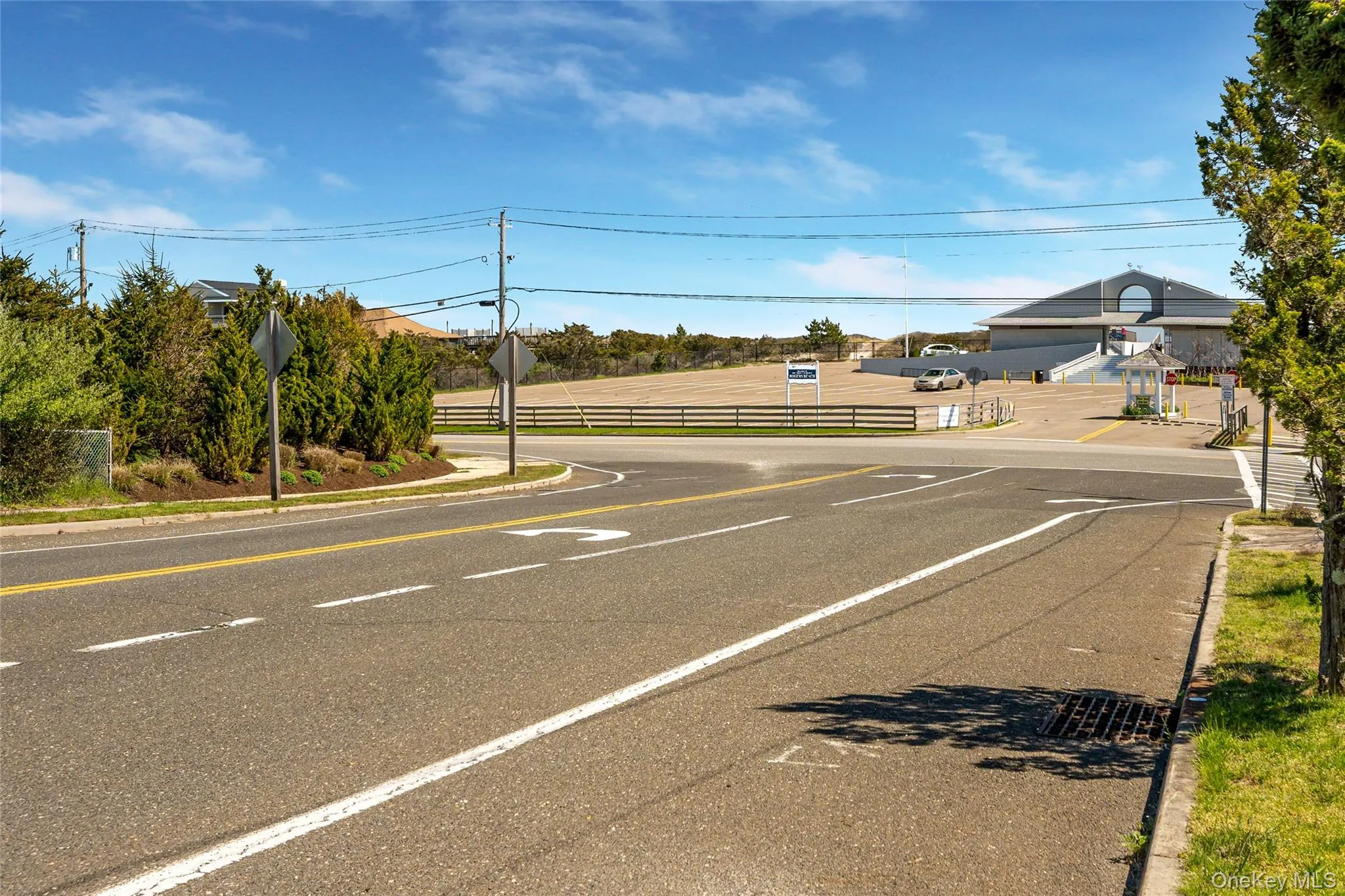View of road with curbs, sidewalks, and traffic signs View of road with curbs, sidewalks, and traffic signs