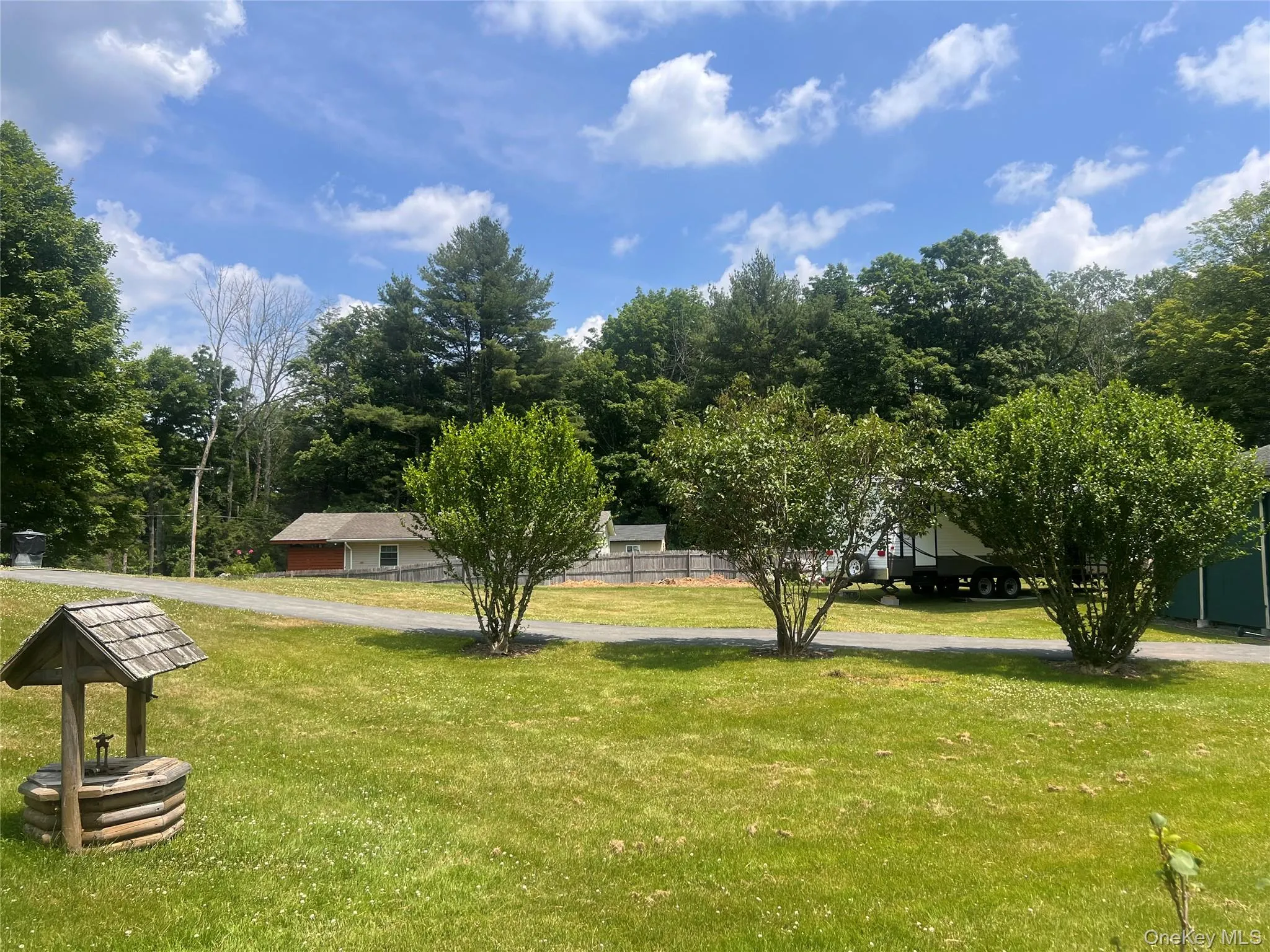 View of home's community featuring a lawn View of home's community featuring a lawn