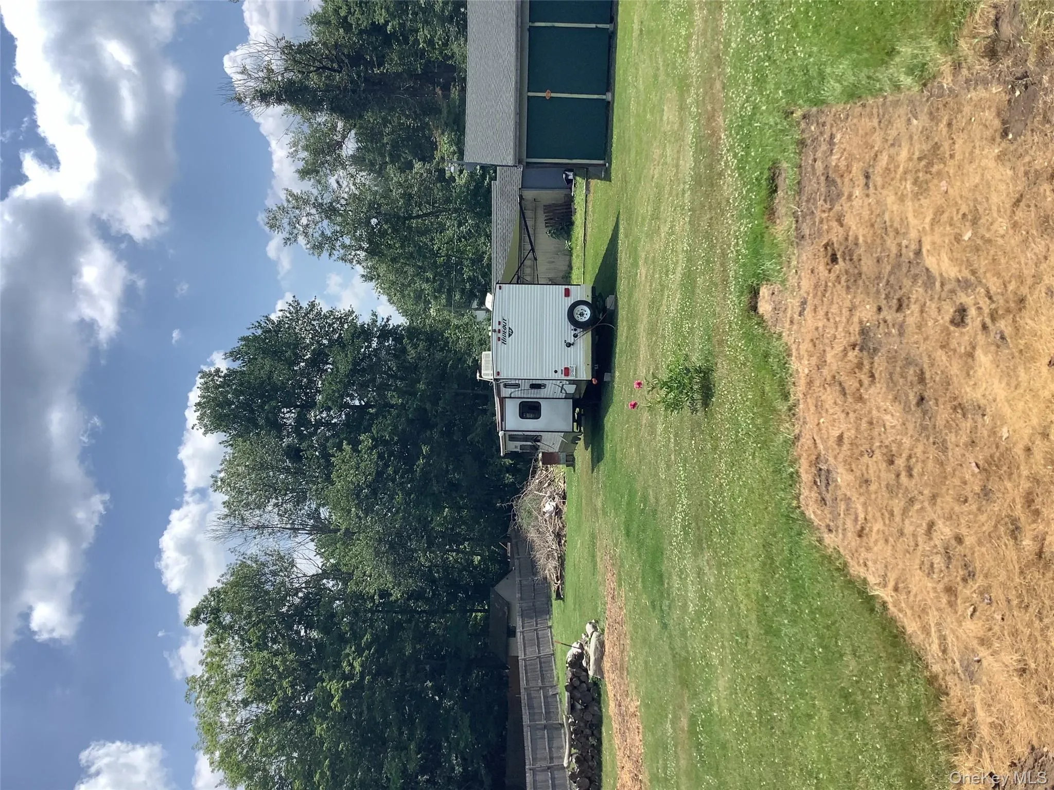 View of yard with an outbuilding View of yard with an outbuilding