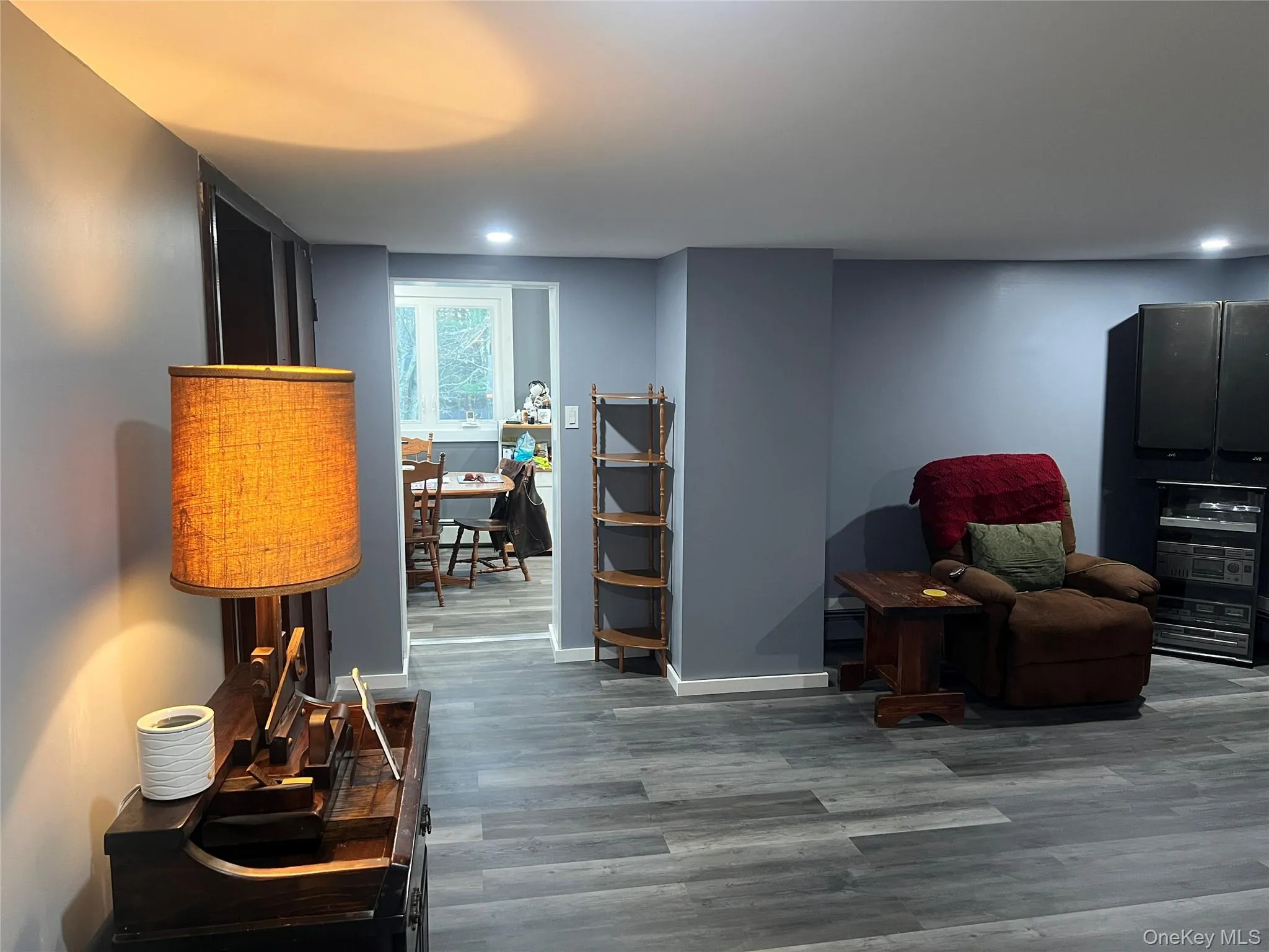 Living area featuring wood finished floors and baseboards Living area featuring wood finished floors and baseboards