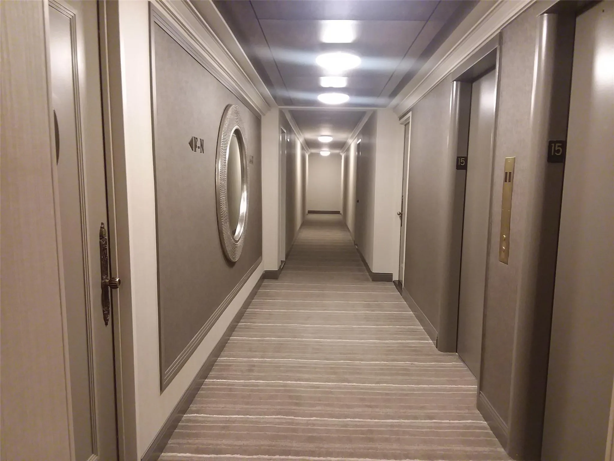 Corridor with light wood-style floors and baseboards Corridor with light wood-style floors and baseboards