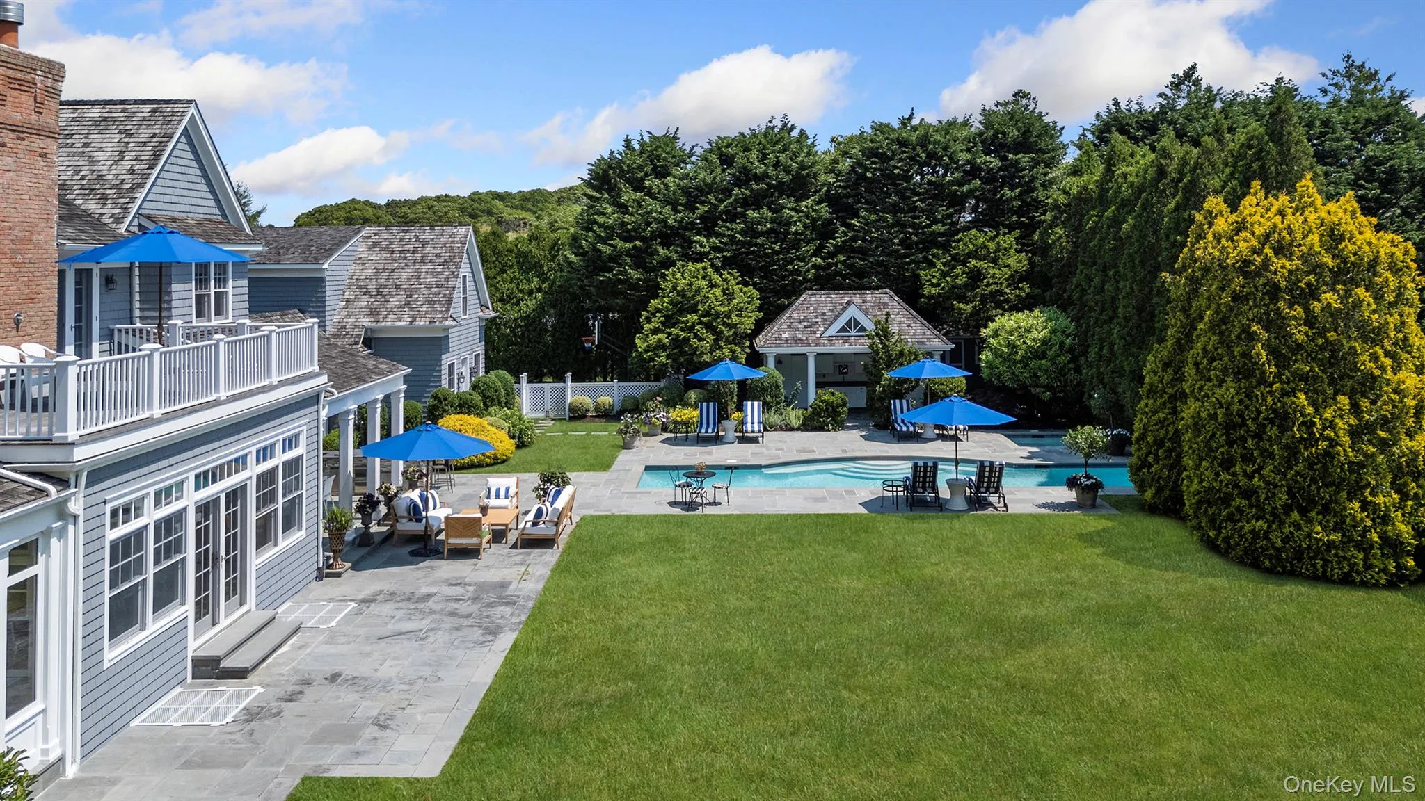 Outdoor pool featuring fence, an outbuilding, a yard, and a patio Outdoor pool featuring fence, an outbuilding, a yard, and a patio