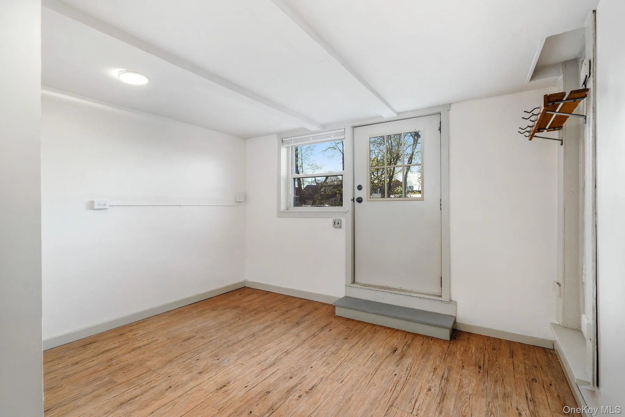 Additional lower level space with door to parking lot. Additional lower level space with door to parking lot.