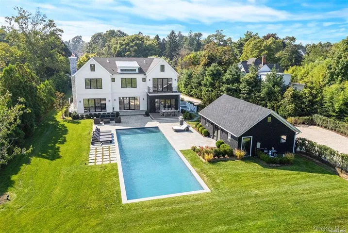 Back of house featuring a 40x60 heated gunite outdoor pool