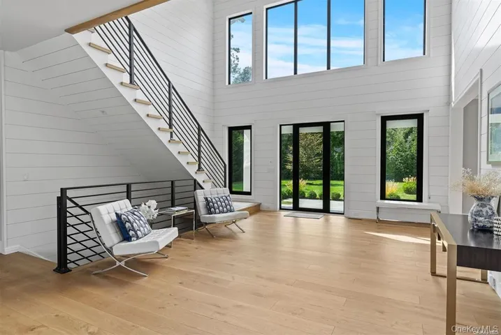 Foyer featuring hardwood floors and a wealth of natural light