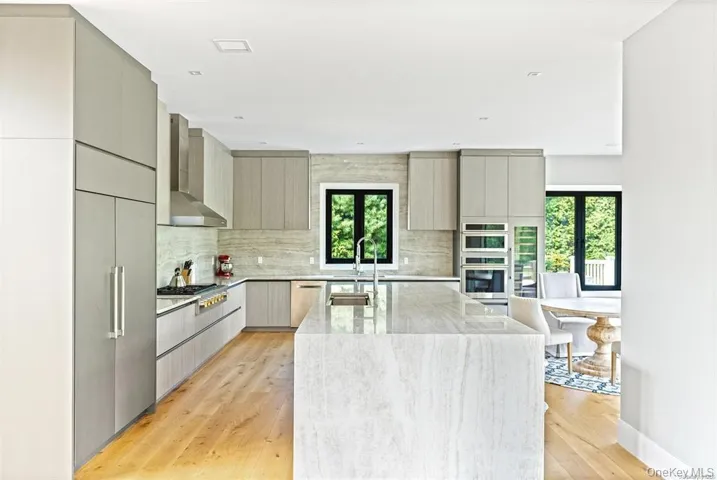 Kitchen with stainless steel appliances and large island