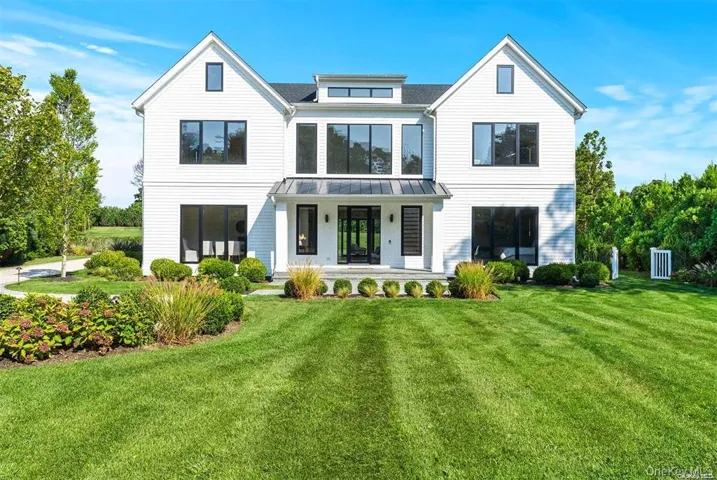 Front of home with expansive lawn
