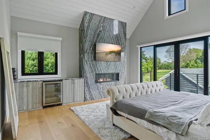 Primary Second Floor Bedroom with beverage cooler  and fireplace