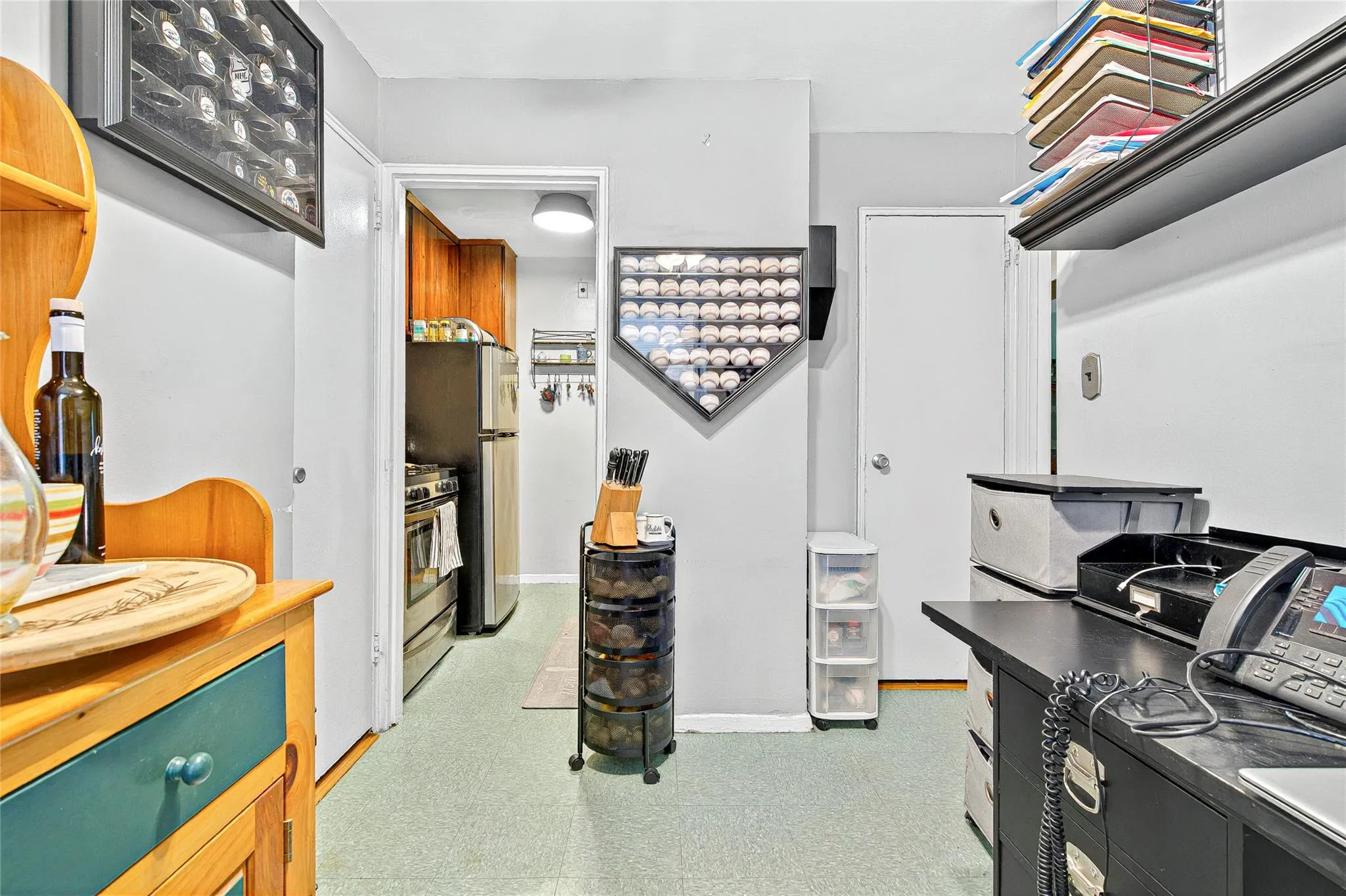 Walk in closet featuring light flooring Walk in closet featuring light flooring