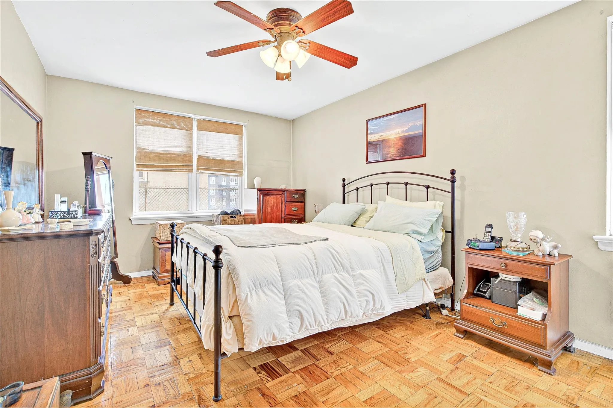 Bedroom with baseboards and a ceiling fan Bedroom with baseboards and a ceiling fan