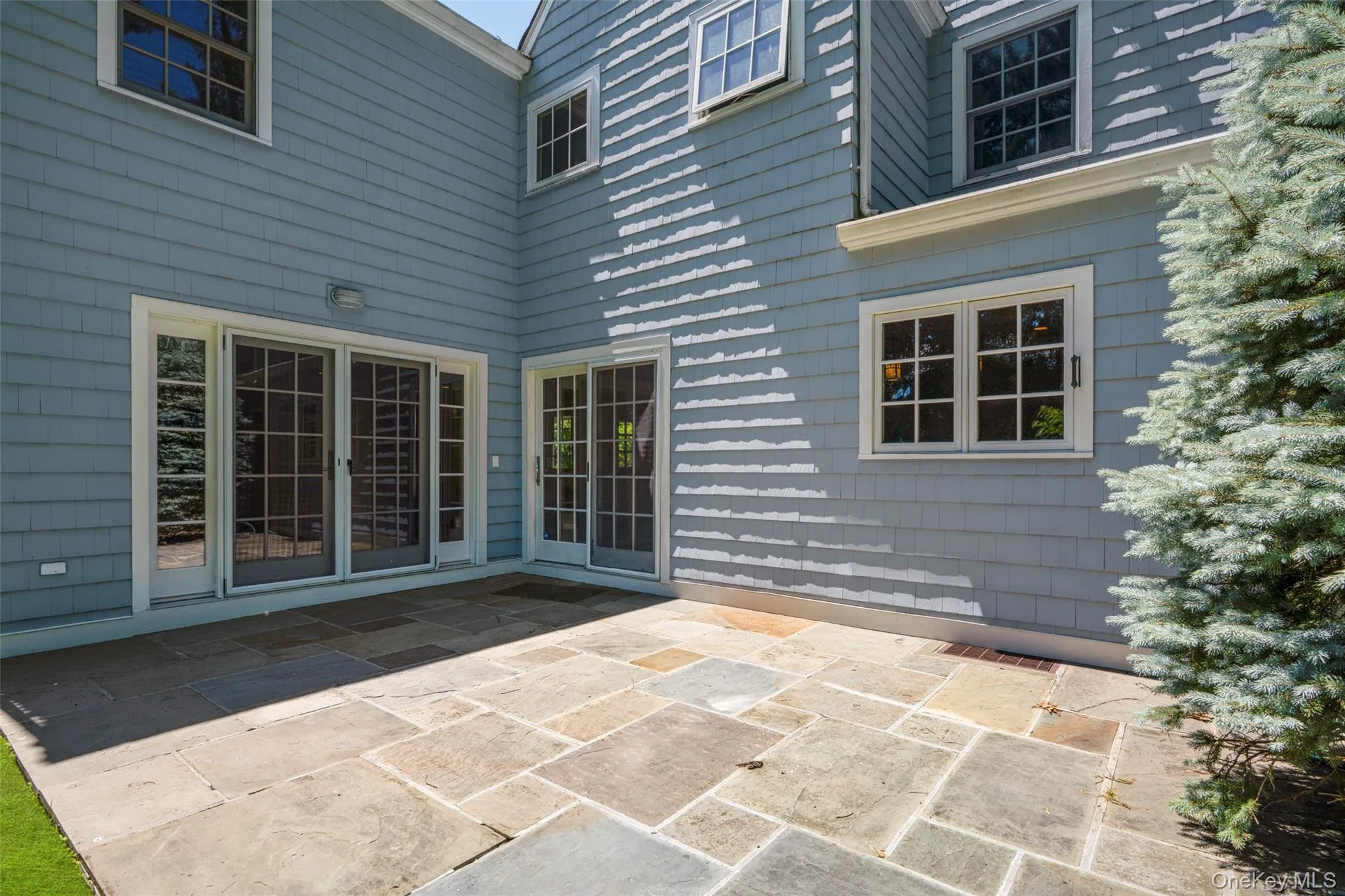 Blue stone patio off of family room and kitchen. Blue stone patio off of family room and kitchen.