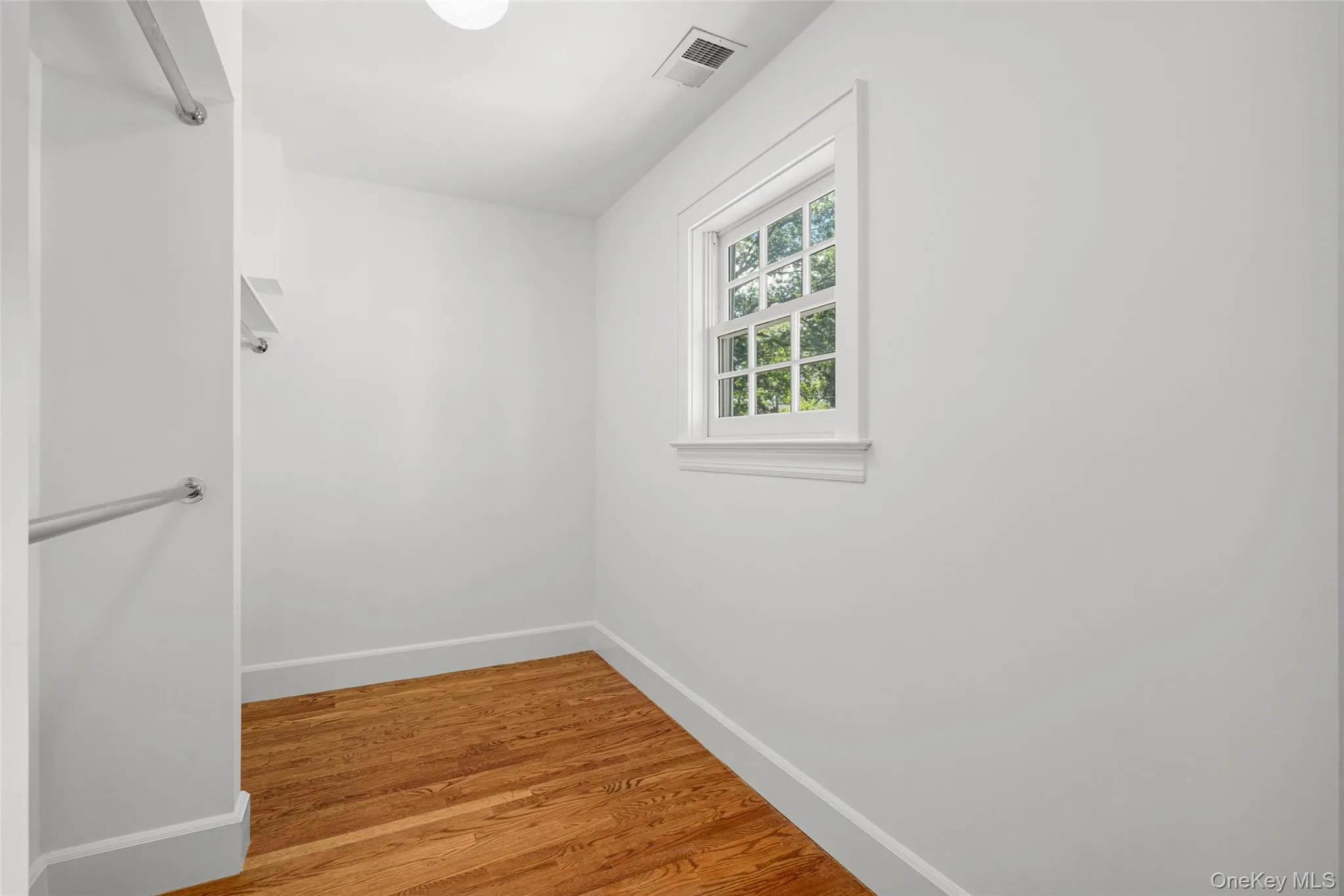 Primary bedroom walk in closet. Primary bedroom walk in closet.