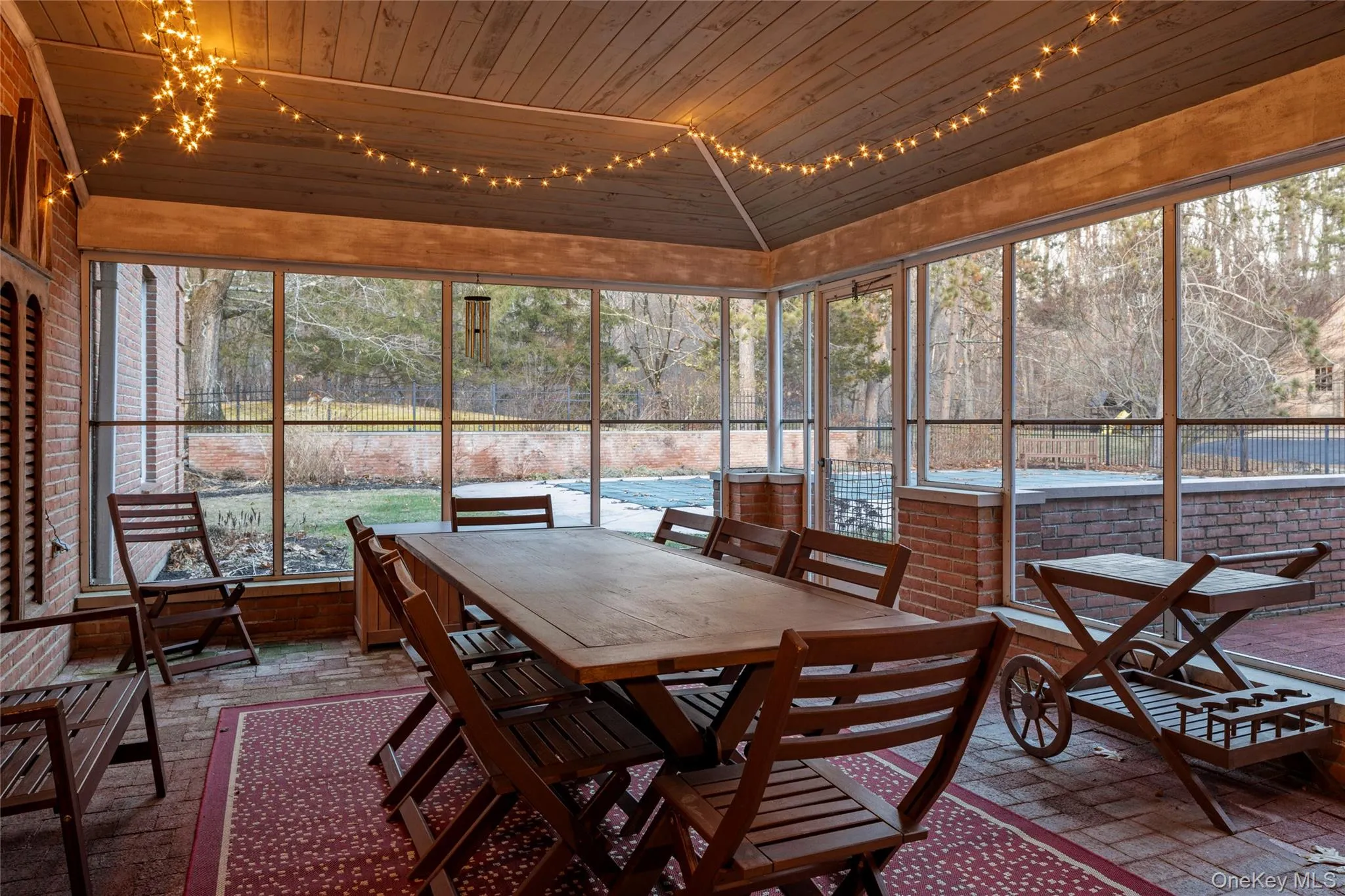 Sunroom / solarium with a healthy amount of sunlight and outdoor dining space Sunroom / solarium with a healthy amount of sunlight and outdoor dining space
