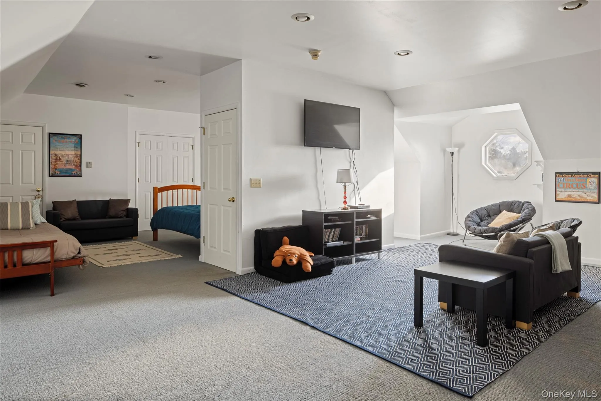 Living room featuring recessed lighting, carpet floors, and baseboards Living room featuring recessed lighting, carpet floors, and baseboards