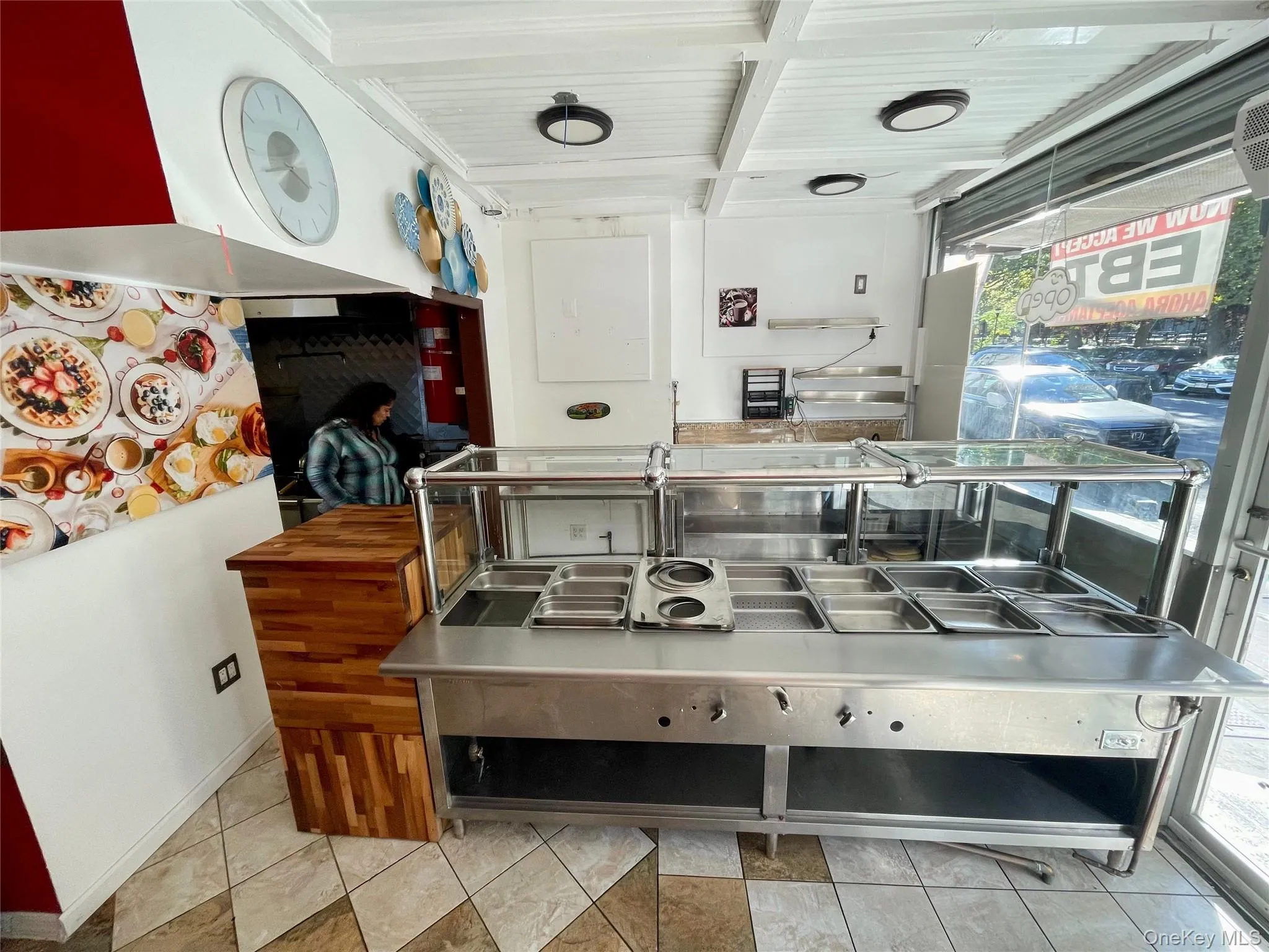 Kitchen with stainless steel counters and beam ceiling Kitchen with stainless steel counters and beam ceiling
