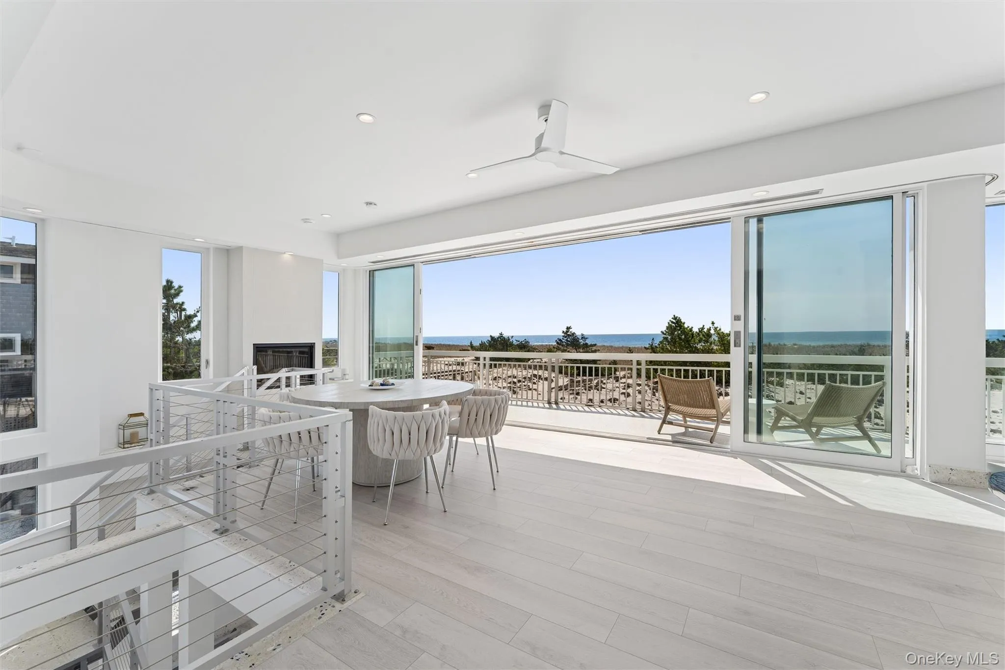Wooden deck featuring a water view and outdoor dining area Wooden deck featuring a water view and outdoor dining area