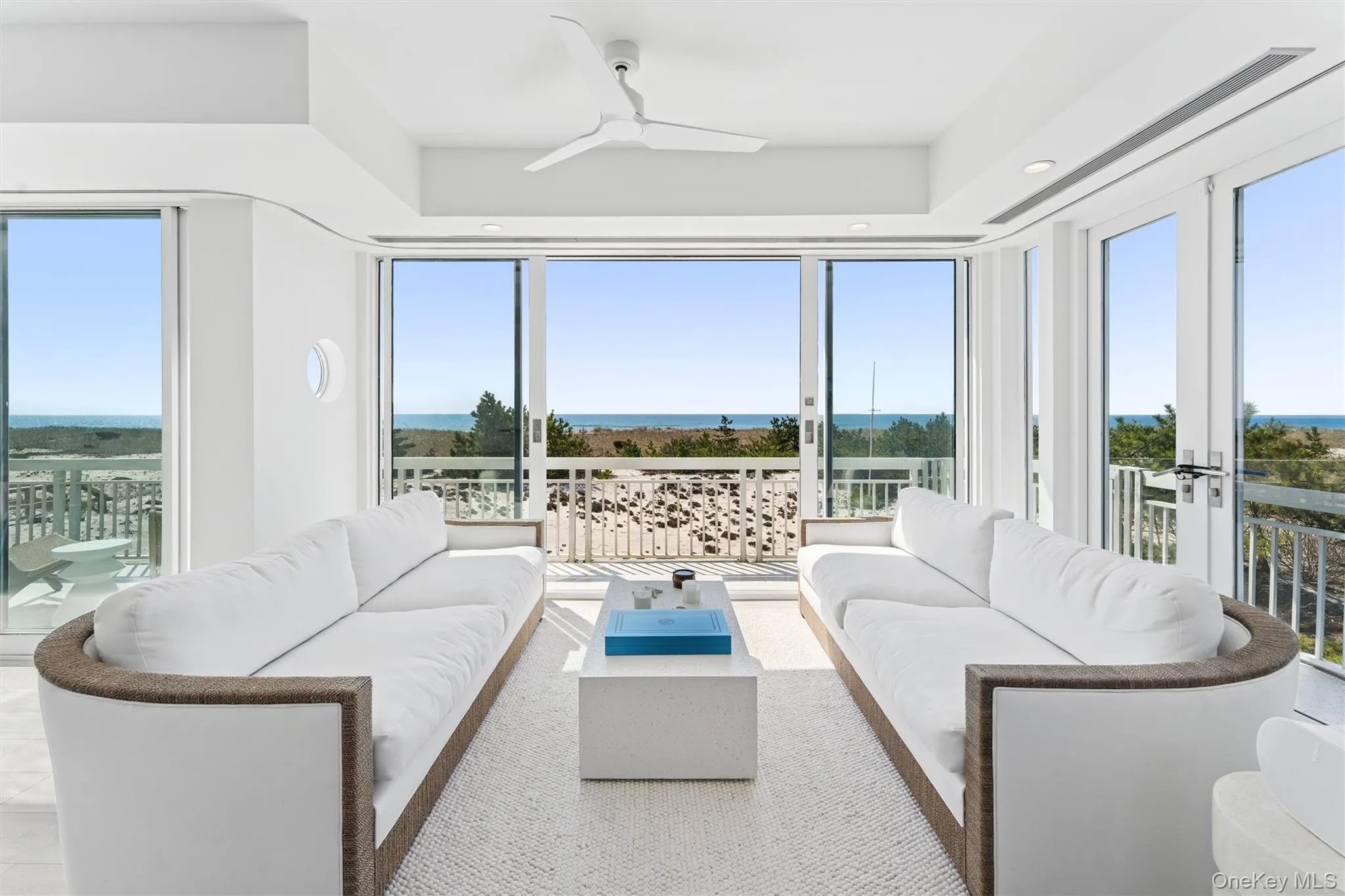 Living area with ceiling fan, french doors, plenty of natural light, and recessed lighting Living area with ceiling fan, french doors, plenty of natural light, and recessed lighting