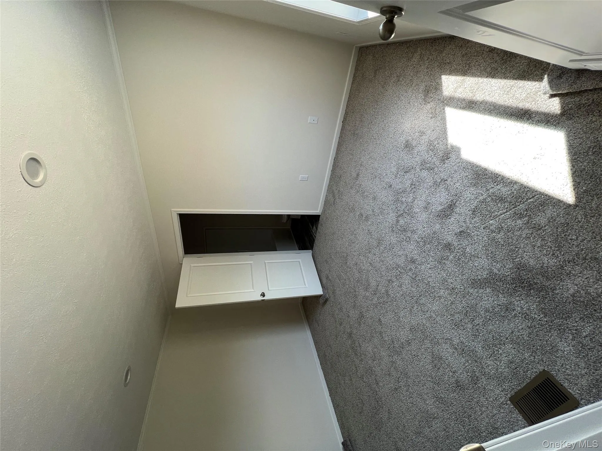 Spare room featuring ornamental molding, a textured ceiling, carpet flooring, and baseboards Spare room featuring ornamental molding, a textured ceiling, carpet flooring, and baseboards